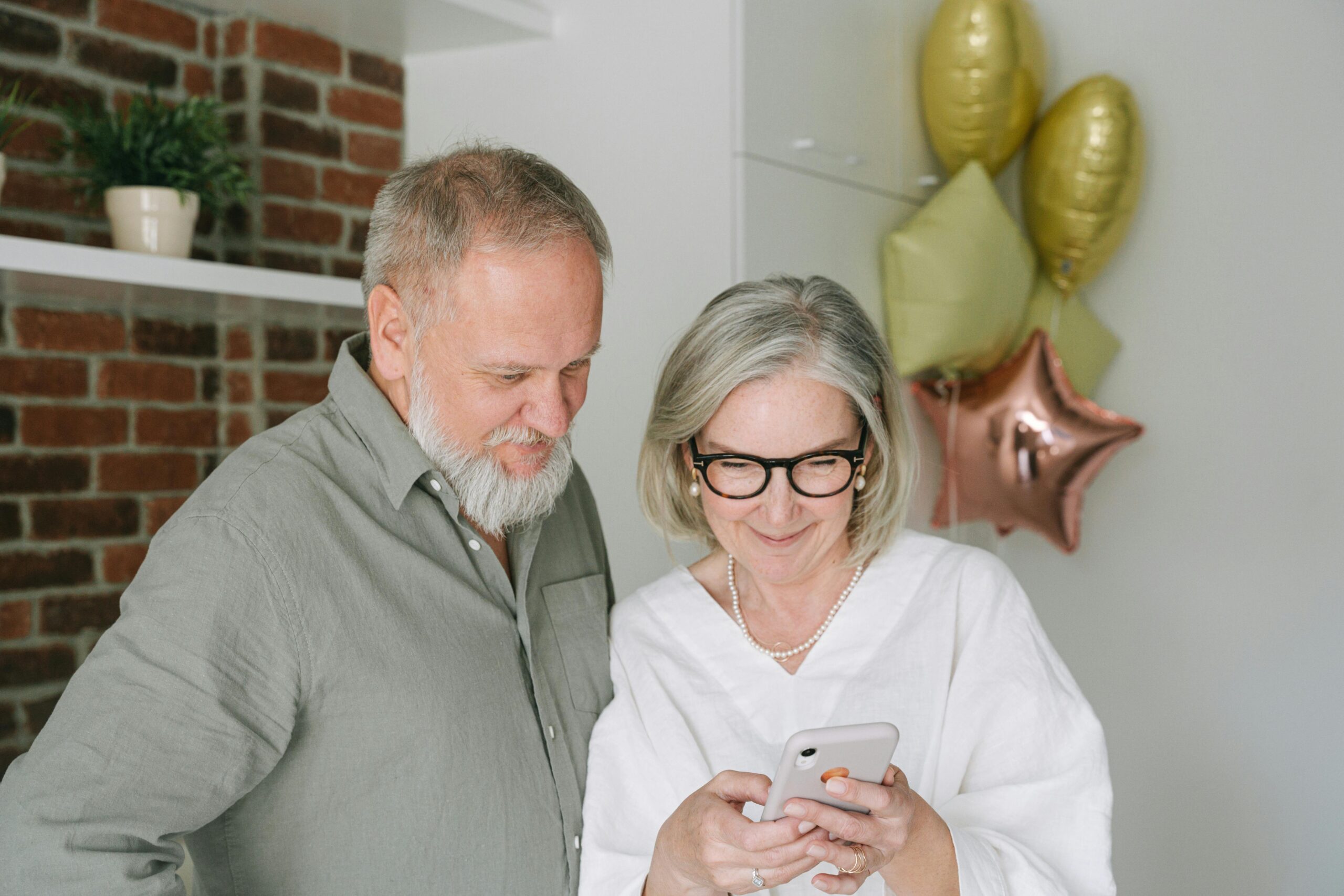 old man and woman on the phone